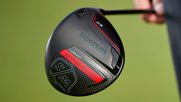 golfer-carrying-wilson-drynapower-driver