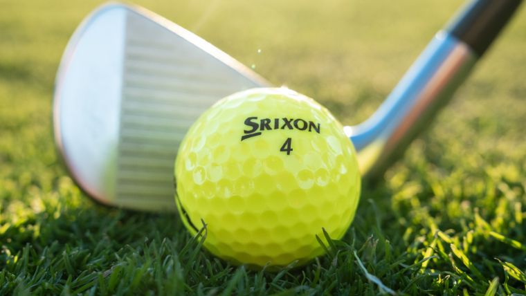 a-srixon-soft-feel-golf-ball-about-to-be-hit-by-an-iron