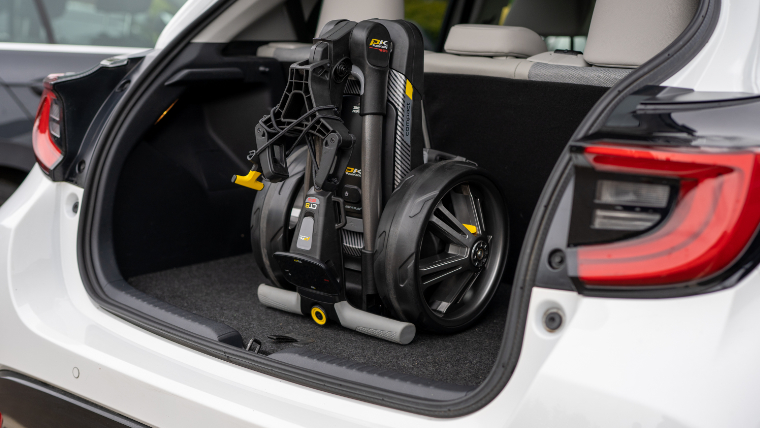 a-PowaKaddy-CT8-GPS-trolley-folded-up-and-secure-in-the-boot-of-a-car