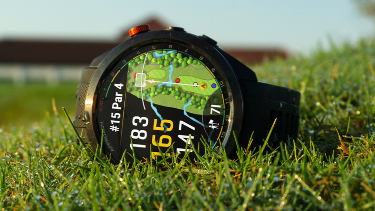 a-garmin-approach-s70-gps-watch-resting-on-grass