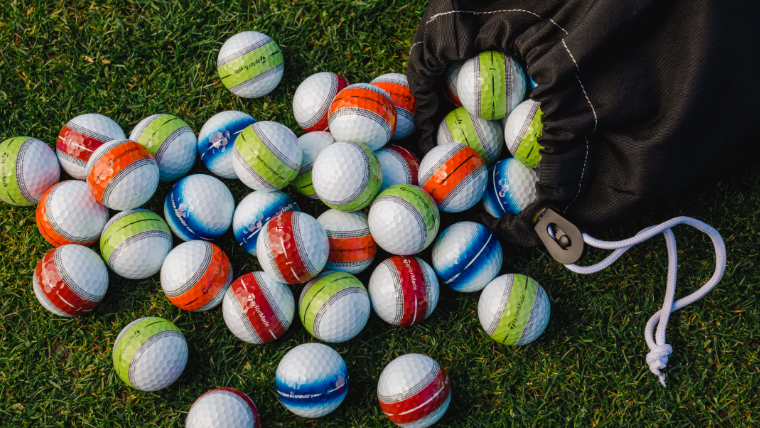 different-coloured-taylormade-tour-response-golf-balls-on-grass