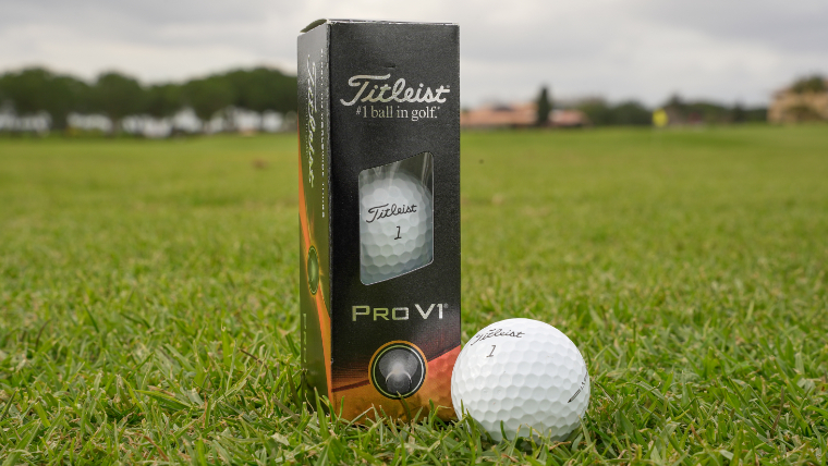 a-titleist-pro-v1-and-sleevelresting-on-grass