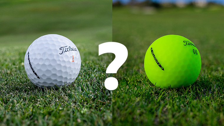 a-white-titleist-golf-ball-golf-ball-next-to-one-with-visual-tech