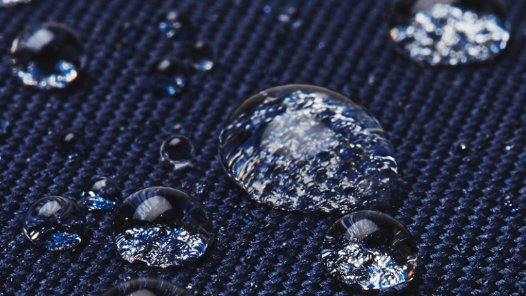 a-close-up-shot-of-raindrops-on-a-waterproof-jacket