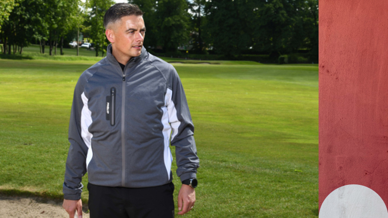 a-golfer-wearing-a-proquip-jacket-on-a-woodland-course