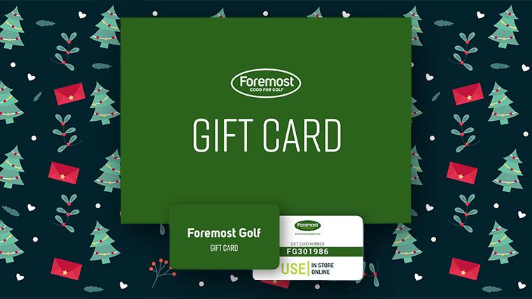 a-foremost-gift-card-with-christmas-trees-and-decorations-in-the-background