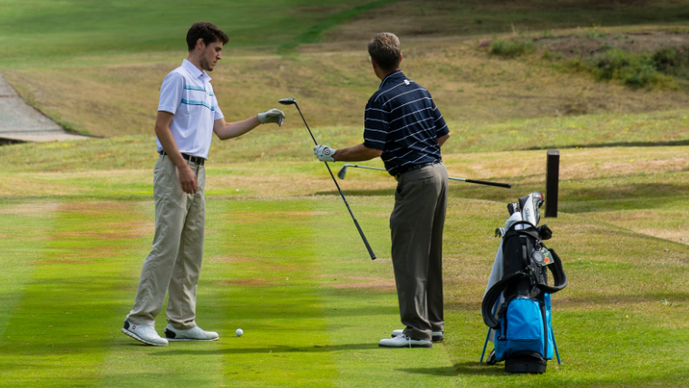 a-golfer-reaching-for-a-fairway-wood
