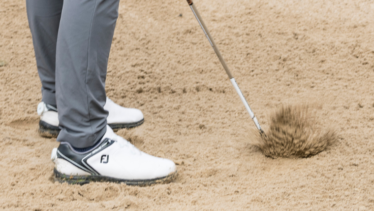 a-golfer-hitting-a-fat-bunker-shot