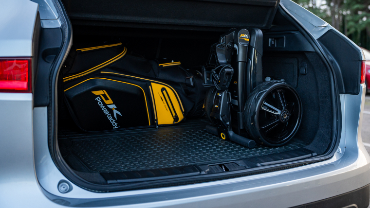 an-electric-trolley-folded-up-in-the-boot-of-a-car