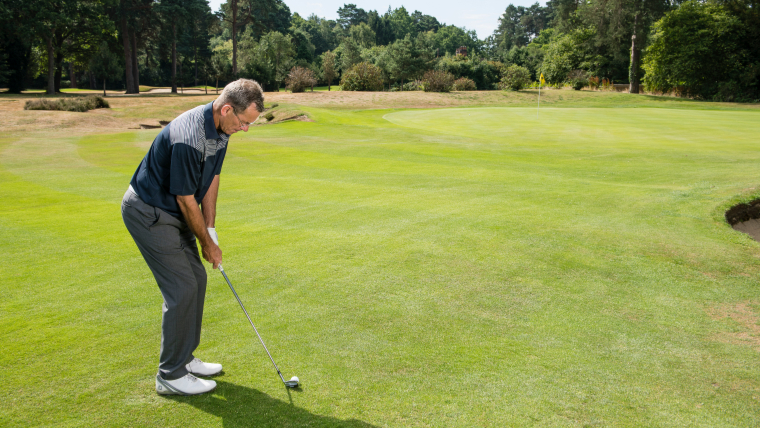 a-golfer-chipping-onto-a-green