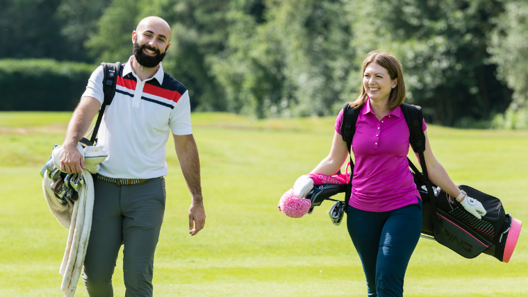 golfers-walking-down-a-fairway