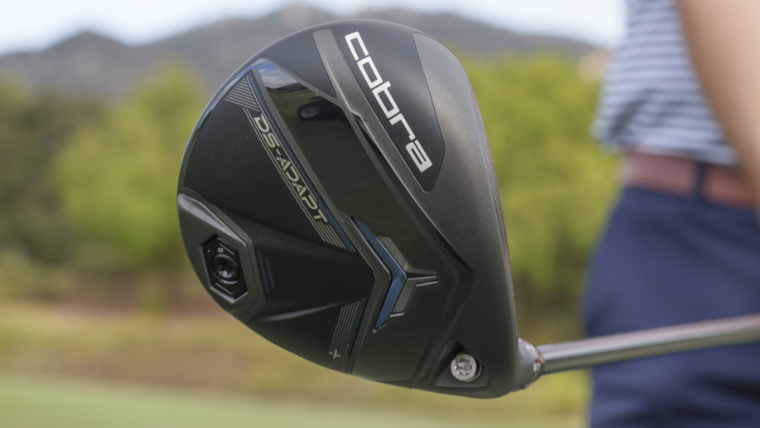 a-golfer-holding-a-cobra-ds-adapt-fairway-wood