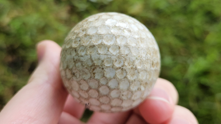 an-old-cracked-golf-ball