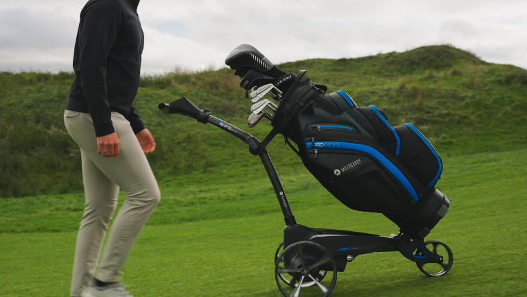 a-golfer-walking-alongside-a-motocaddy-electric-trolley