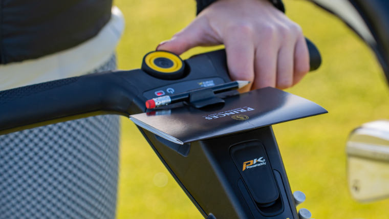 a-close-up-of-the-scorecard-holder-on-a-powakaddy-trolley