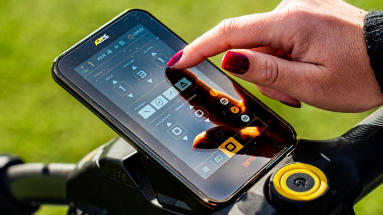 a-golfer-using-the-touchscreen-on-a-powakaddy-electric-trolley