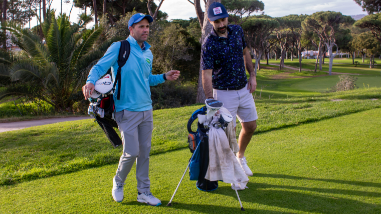 two-golfers-standing-on-a-tee