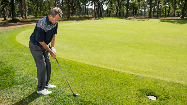 a-golfer-using-a-hybrid