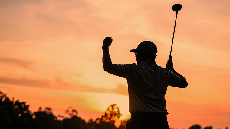 a-golfer-cheering-holding-a-driver