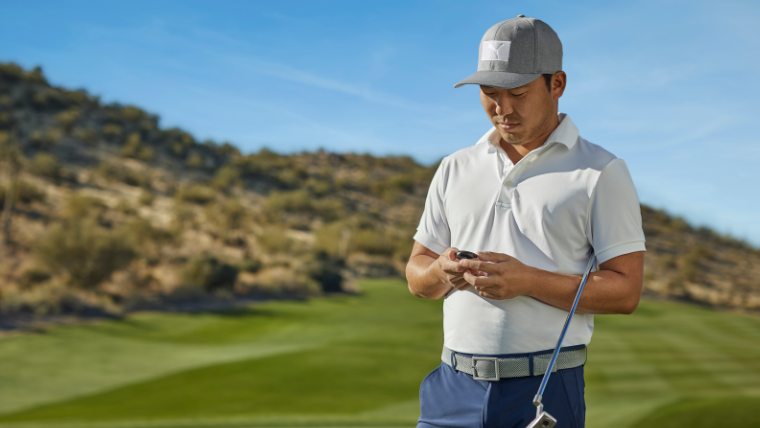 a-golfer-using-a-garmin-g12-gps-device