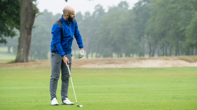 a-golfer-hitting-an-approach-shot-on-a-fairway