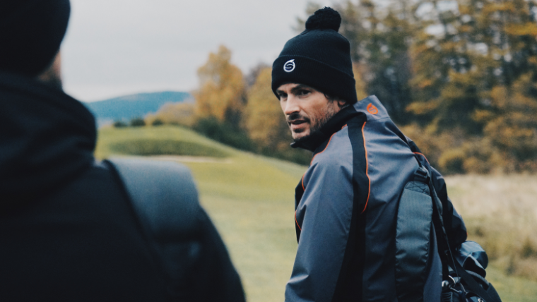 a-golfer-wearing-a-sunderland-waterproof-jacket