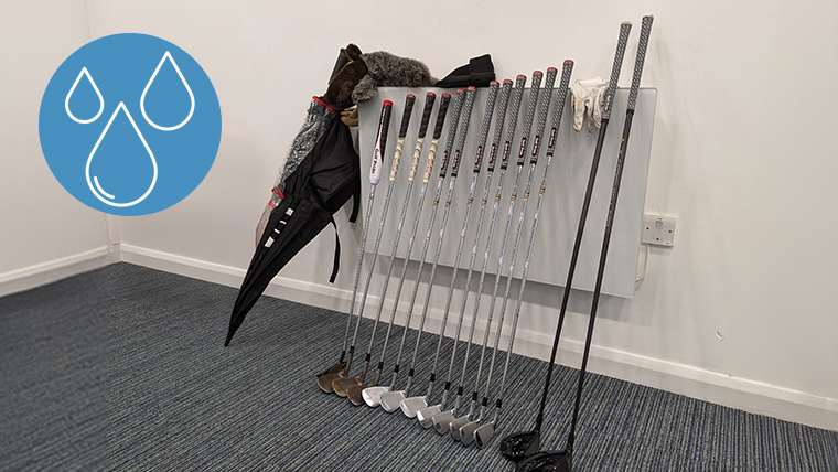 golf-gear-lined-up-against-a-radiator