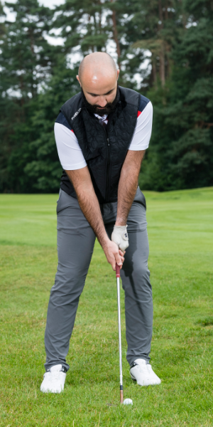 a-golfer-standing-at-address