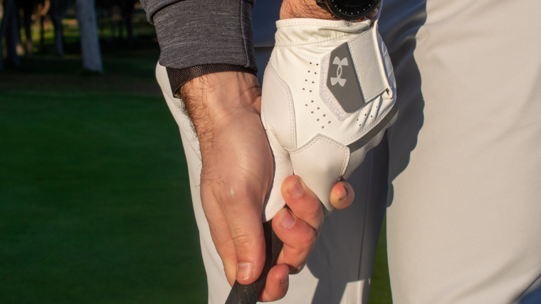 a-golfer-wearing-an-under-armour-golf-glove