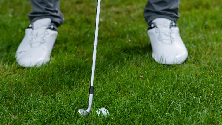 Wedge shot from wet grass