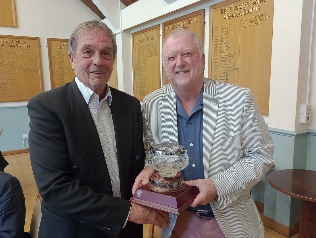 Neil Blick presenting to winner Malcolm Wells